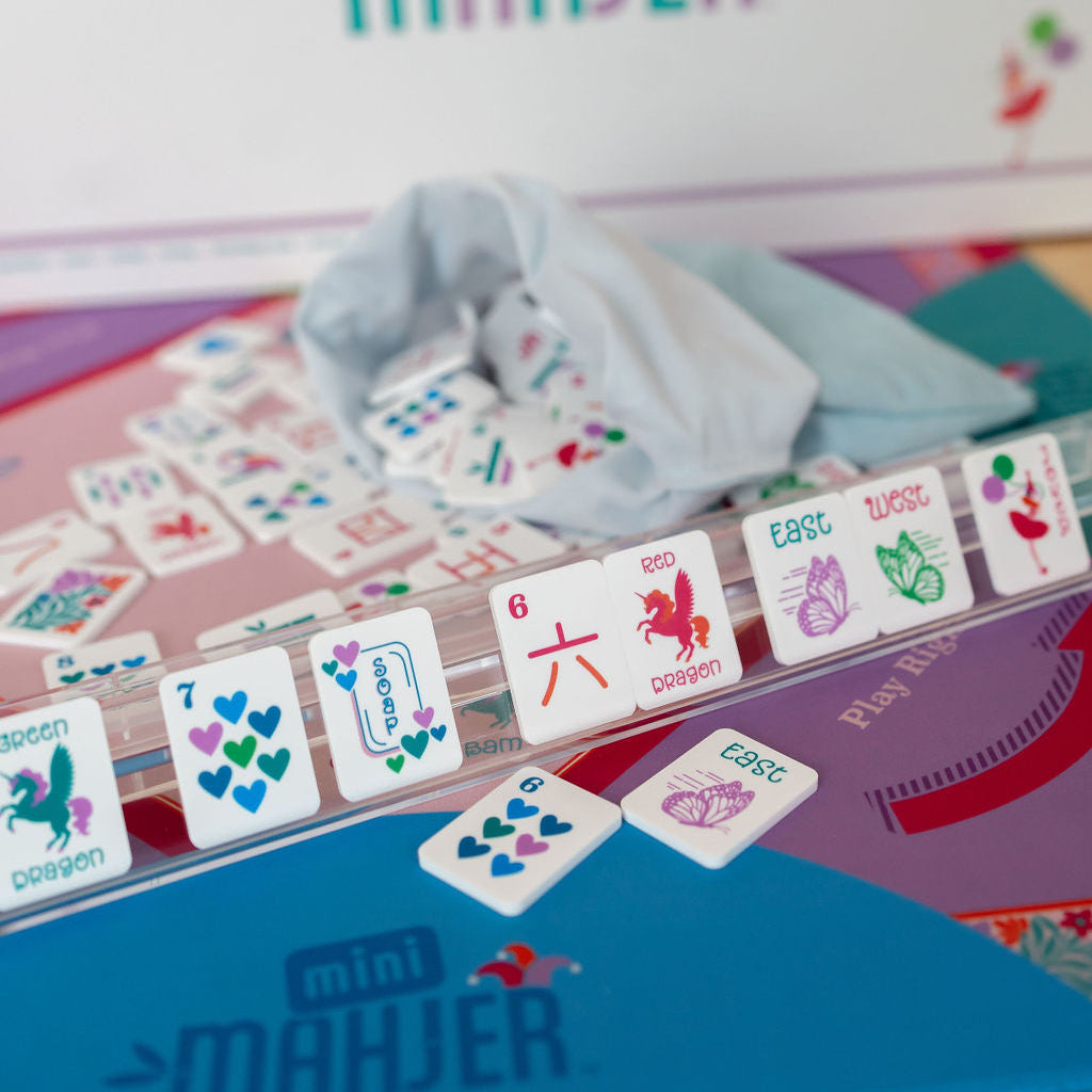 beautiful mahjong tiles on a clear rack