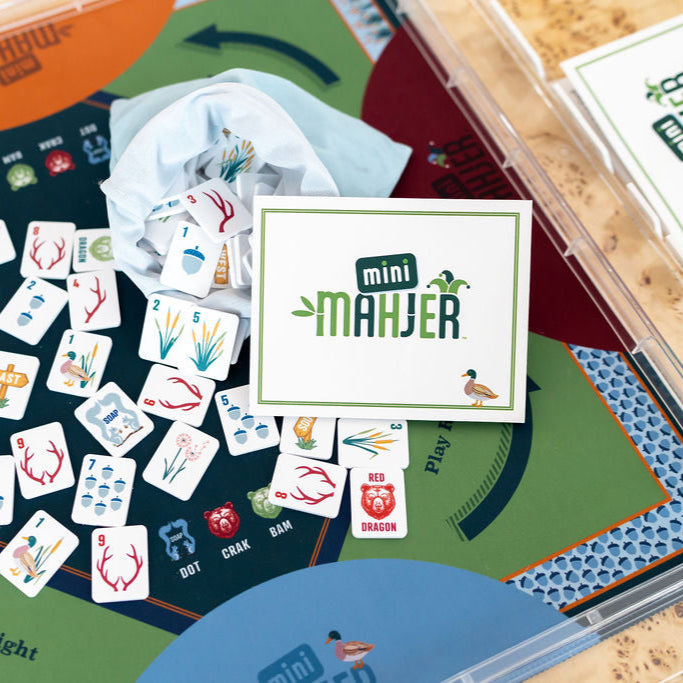 Kids Mahjong Tile Set with a woodland theme with a mahjong card, tiles, mat, and racks