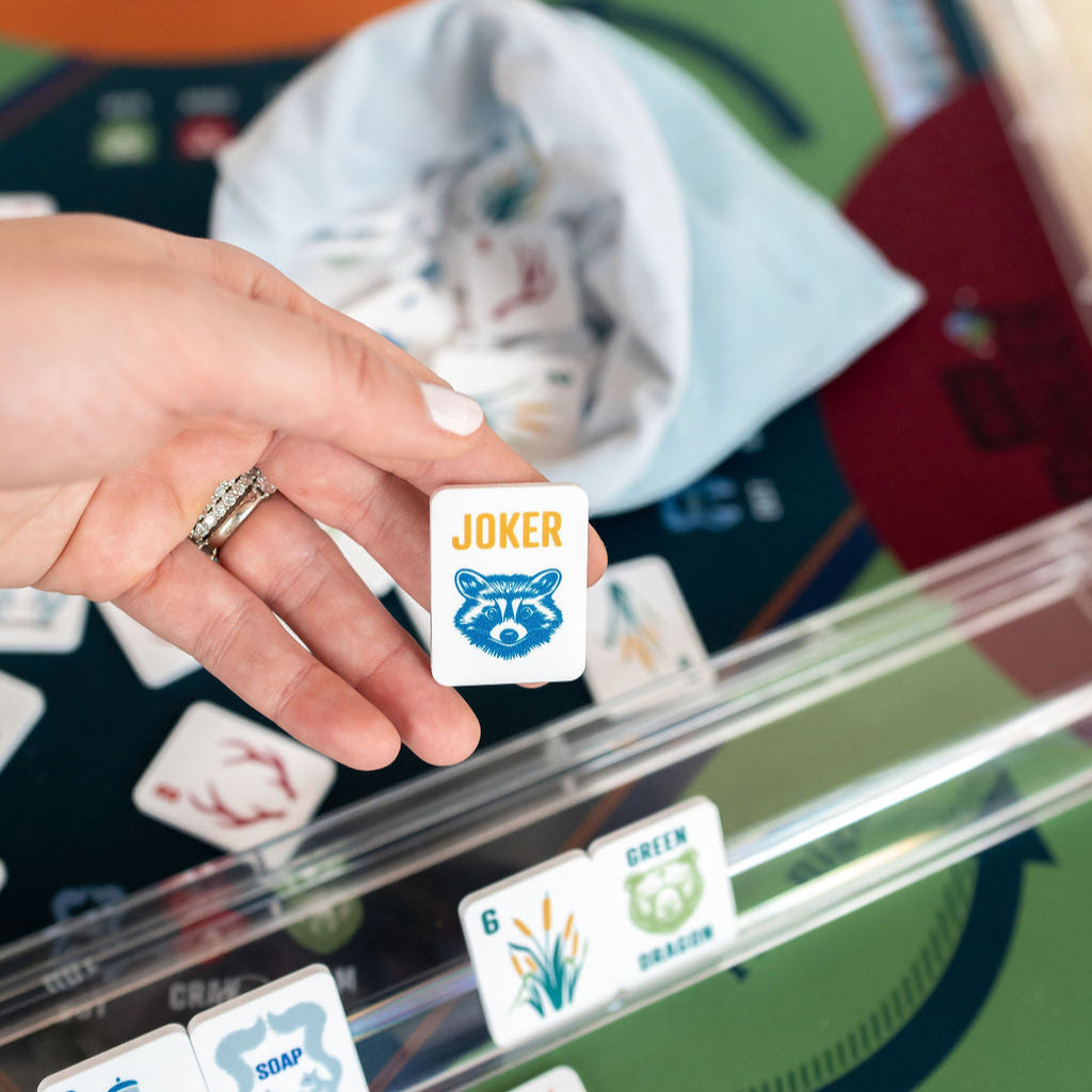close up of a mahjong joker tile featuring a raccoon