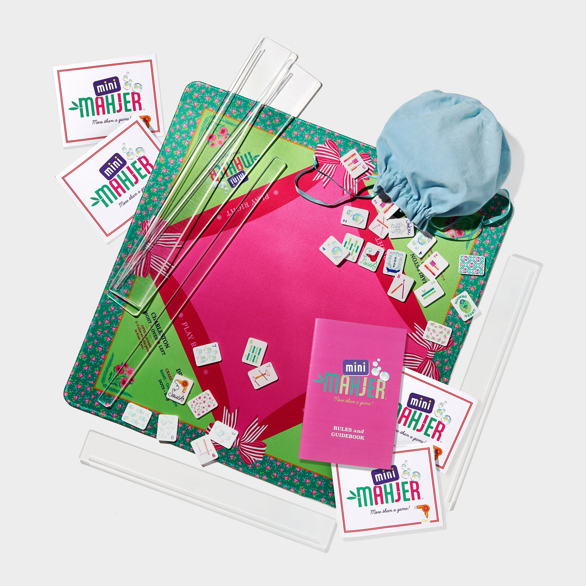 Mini Mahjer Bubbles & Bows Edition complete Mahjong game set with tiles, mat, travel racks, cards, and instructional guide