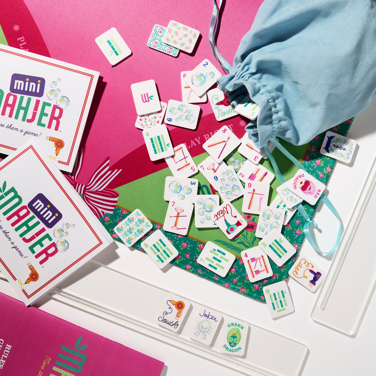 Mini Mahjer Bubbles & Bows Edition Mahjong tiles, neoprene mat, travel racks, tile bag, and Mini Mahjer cards