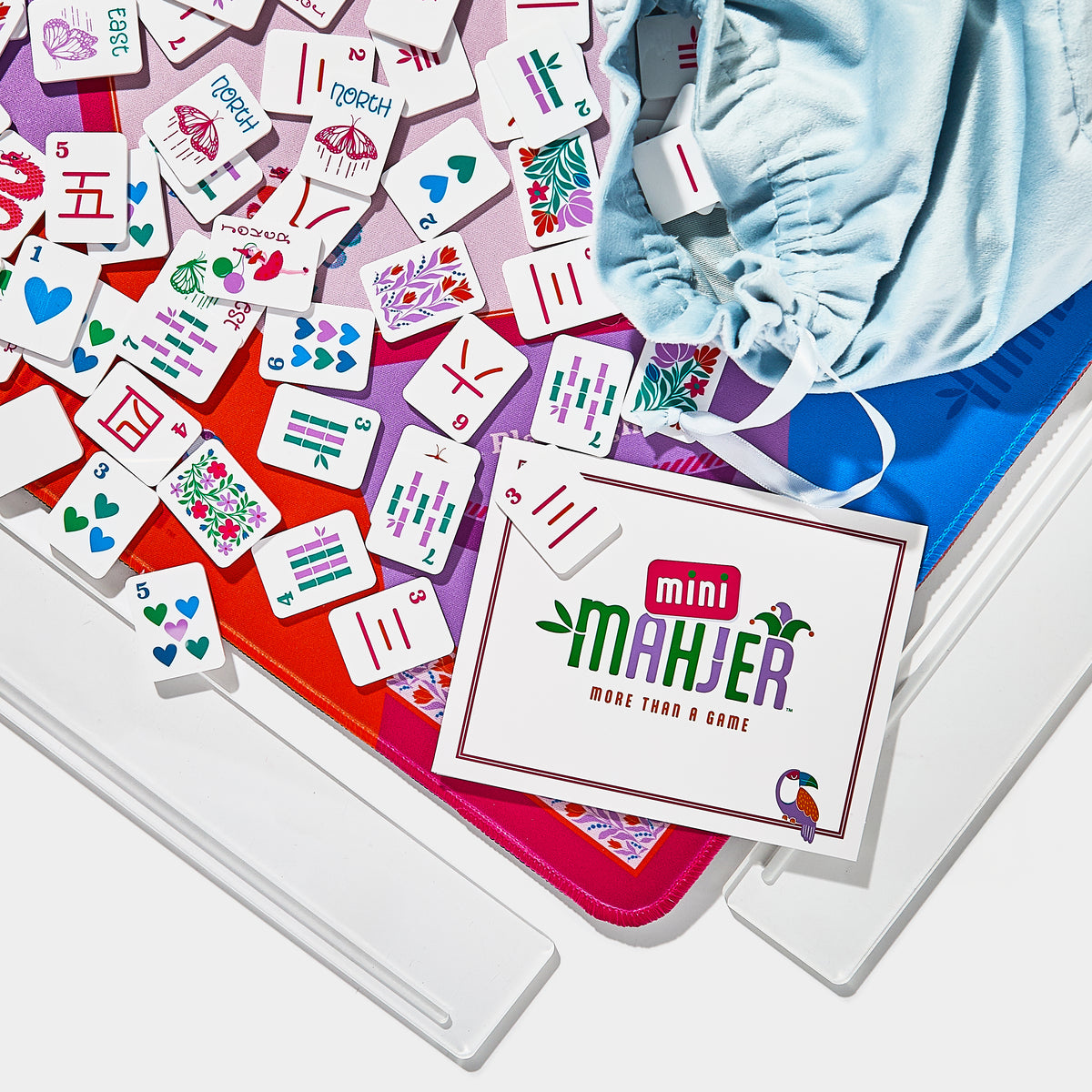 Mini Mahjer Rackin' Rosie Edition Mahjong tiles, neoprene mat, travel racks, tile bag, and Mini Mahjer cards