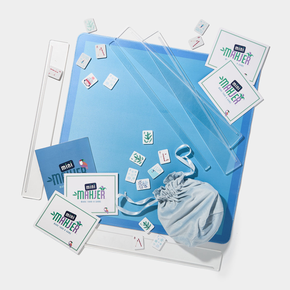 Mini Mahjer Ski Edition complete Mahjong game set with tiles, mat, travel racks, cards, and instructional guide